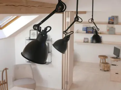 a room with three black lights hanging from the ceiling at House Design Vipiteno in Vipiteno