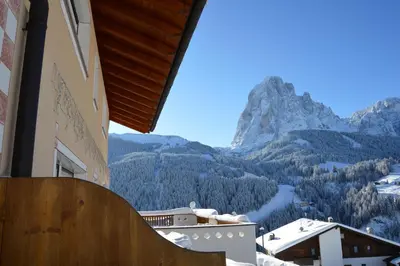 a balcony with a view of a mountain at Apartments Etruska Gabriela in Santa Cristina in Val Gardena