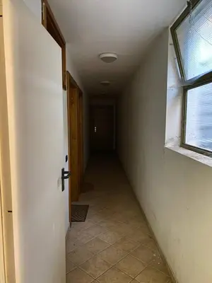 an empty hallway with a door and a window at Chalet Panorama Dolomiti vicino piste, centro e Cortina in San Vito di Cadore