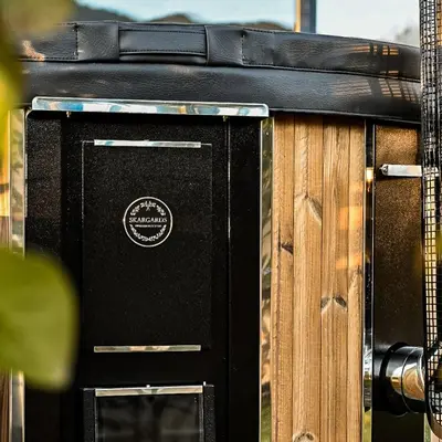 a black television sitting next to a wooden fence at Pitzoler Hof in Albes