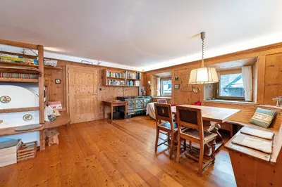 a dining room with a table and chairs at Apartments Frea - Vedl Luech da Plajes in Ortisei