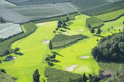 an aerial view of a golf course in a vineyard at Penthouse&Wellness L'Abete in Gargazzone