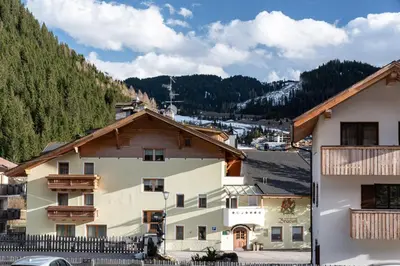 a group of buildings in a mountain village at ciasa monaco in Corvara in Badia
