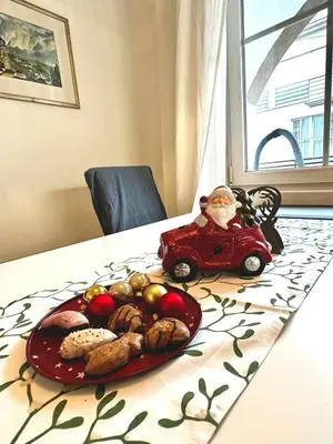 a plate of food on a table with a toy car at Baker House in Bolzano