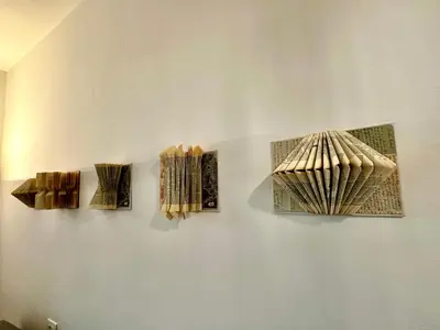 four pieces of art hanging on a wall at Baker House in Bolzano