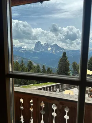 a view of a mountain from a window at Chalet Resciesa Ortisei in Ortisei
