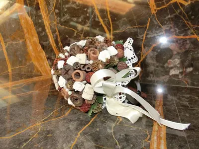 a bouquet of cookies and a bow on a table at CORTINA Lodge in Cortina dʼAmpezzo