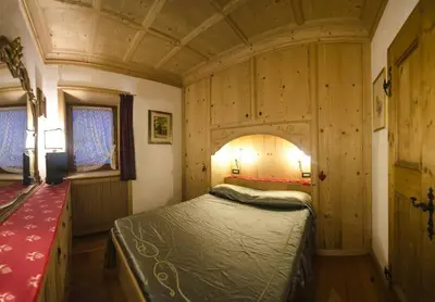 a bedroom with a bed in a room at Villa Lucente in Alvera