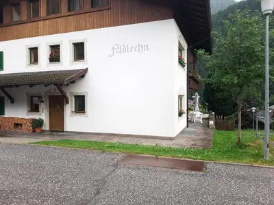a white building with the word religion on it at Feldlechn in Lappago
