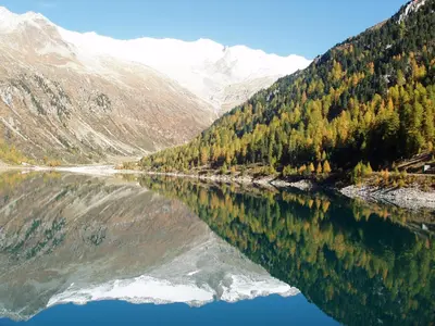 a reflection of a mountain in a body of water at Feldlechn in Lappago