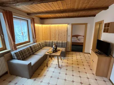 a living room with a couch and a table at Lenzerhof in Lappago