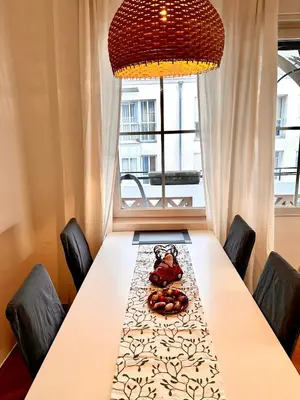 a dining room table with a teddy bear sitting on top at Townhouse Bozen in Bolzano