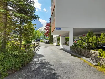 a road outside of a building with a car parked at Fradusta 213 in San Martino di Castrozza