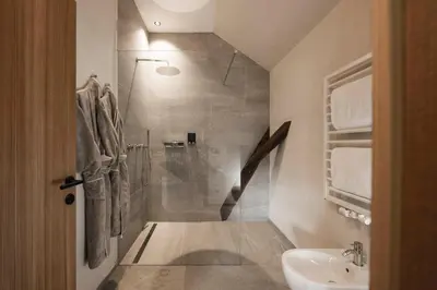 a bathroom with a shower and a sink at Ansitz Heufler by Norbert Niederkofler in Rasun di Sopra