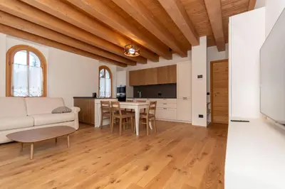 a living room with a couch and a table at Villa Caterina in Falcade