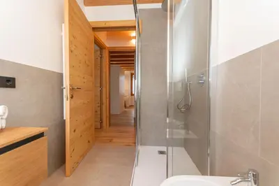 a bathroom with a shower and a sink at Villa Caterina in Falcade