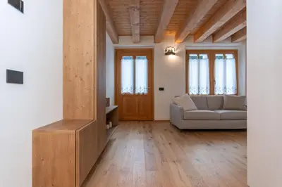 a living room with a couch and a table at Villa Caterina in Falcade