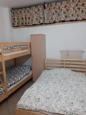 a bedroom with two bunk beds and a bed at Bilocale Cristina Mazzin in Campestrin