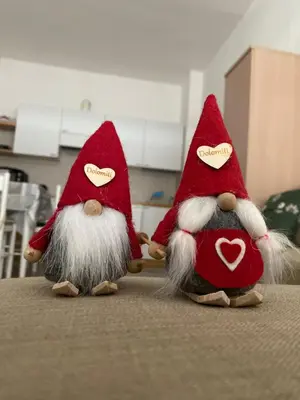 two christmas gnomes are sitting on a table at Bilocale Cristina Mazzin in Campestrin