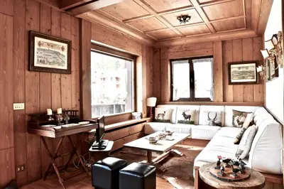 a living room with a couch and a table at Beautiful 3 bedroom flat in Cortina with car park in Cortina dʼAmpezzo