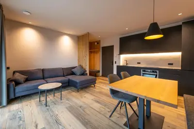 a living room with a couch and a table at Malojerhof in Lana