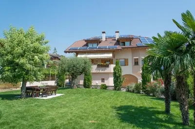 a house with solar panels on the roof at Sonngartenhof in Termeno