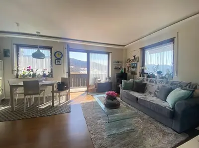 a living room with a couch and a table at Alpenrösli Hafling in Avelengo