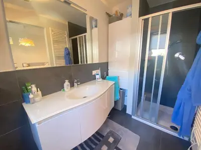 a bathroom with a sink and a large mirror at Alpenrösli Hafling in Avelengo
