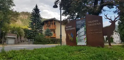 a sign in the grass in front of a building at VILLA TERESA in San Lugano