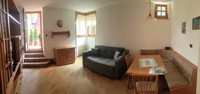 a living room with a couch and a table at VILLA TERESA in San Lugano