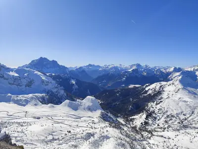 an aerial view of a snowy mountain range at Panorama mozzafiato in Cortina dʼAmpezzo