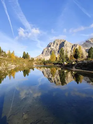 a reflection of a mountain in a body of water at Panorama mozzafiato in Cortina dʼAmpezzo
