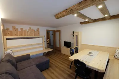 a living room with a couch and a table at Gasserhof in Campo di Trens