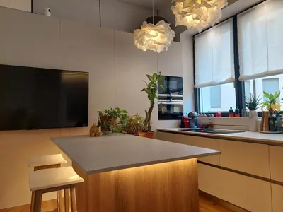 a kitchen with a island with a counter top at Loft del Talvera 2 in Bolzano