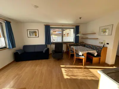 a living room with a couch and a table at Appartments Anna in Valdaora di Sotto