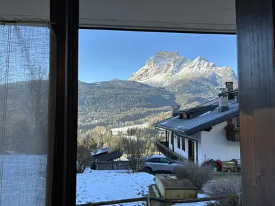 a view of a mountain from a window at Casa alla Sorgente, con vista panoramica in San Vito di Cadore