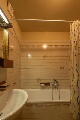 a bathroom with a tub and a sink at Casa alla Sorgente, con vista panoramica in San Vito di Cadore
