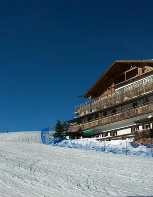a building on top of a snow covered slope at Verweilen auf Meran 2000 in Avelengo