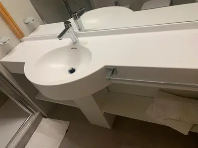 a bathroom with a white sink and a mirror at casa canazei in Alba di Canazei