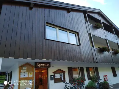 a building with a sign that reads ricochet at casa canazei in Alba di Canazei