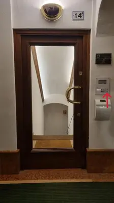 a door with a mirror in a room at Studio Apartment Ariston in centro a Cortina in Cortina dʼAmpezzo