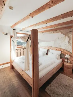 a bedroom with two bunk beds in a room at Hotel Piz Seteur in Selva di Val Gardena