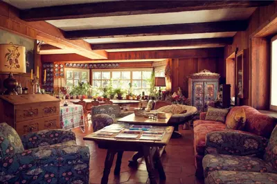 a living room filled with furniture and a table at B&B Villa La Bercia in San Vigilio Di Marebbe