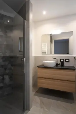 a bathroom with a sink and a mirror at Abete rosso in Tesero