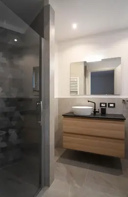 a bathroom with a sink and a mirror at Abete rosso in Tesero