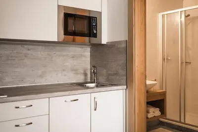 a kitchen with a sink and a microwave at Oberhuberhof in Rodengo