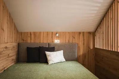 a bedroom with a bed and a desk and a couch at Oberhuberhof in Rodengo