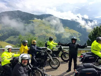 a group of people on motorcycles on a road at B&B Villa Dolomites Hut in San Vigilio Di Marebbe