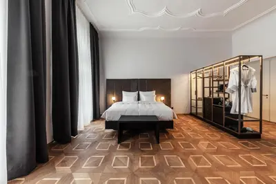 a bedroom with a bed and a display case at META SUITES historic city living in Bolzano