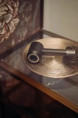 a spatula sitting on a plate on a table at META SUITES historic city living in Bolzano